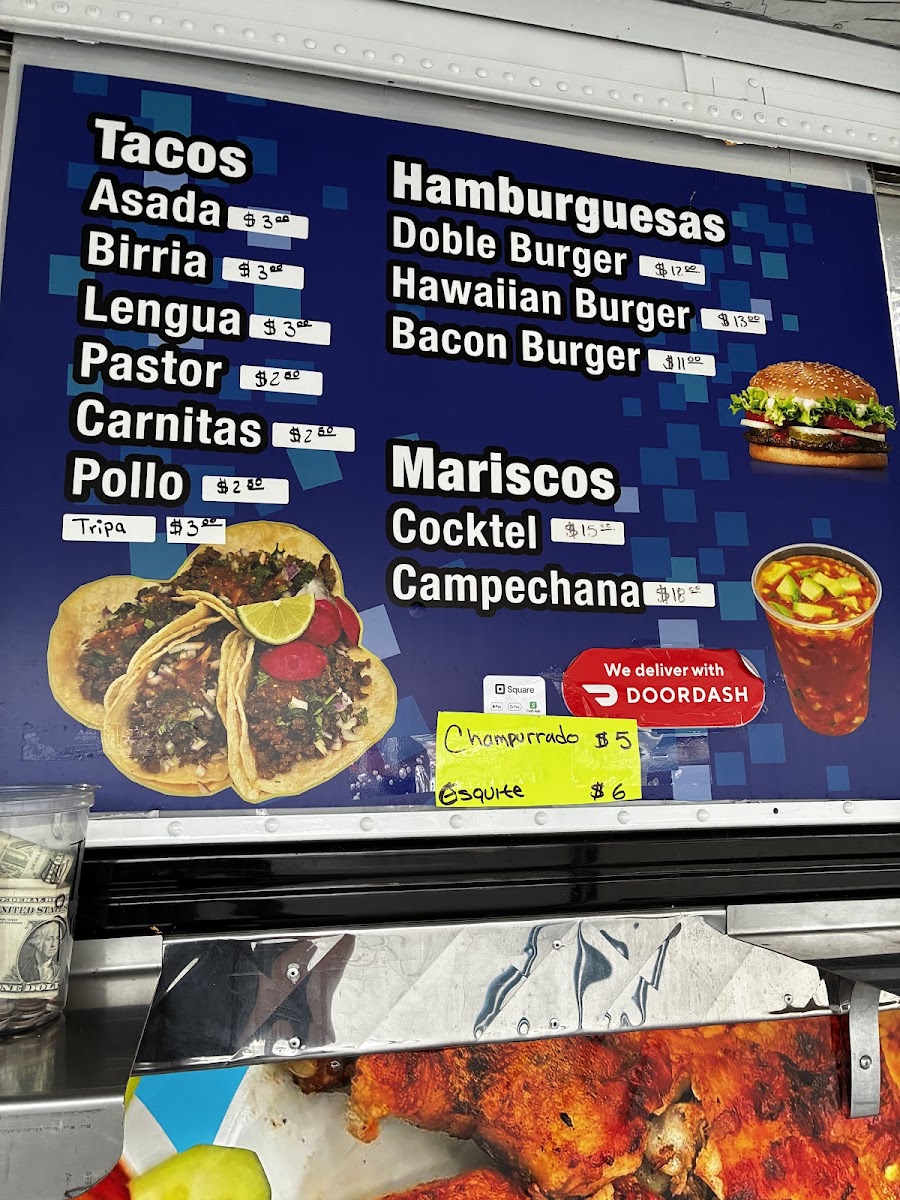 Taquería Los Charros menu board