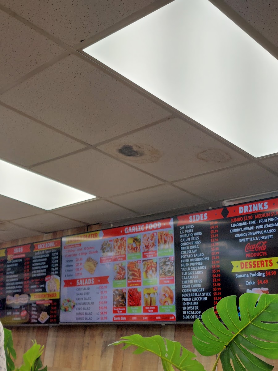 Tasty seafood chicken and subs menu board