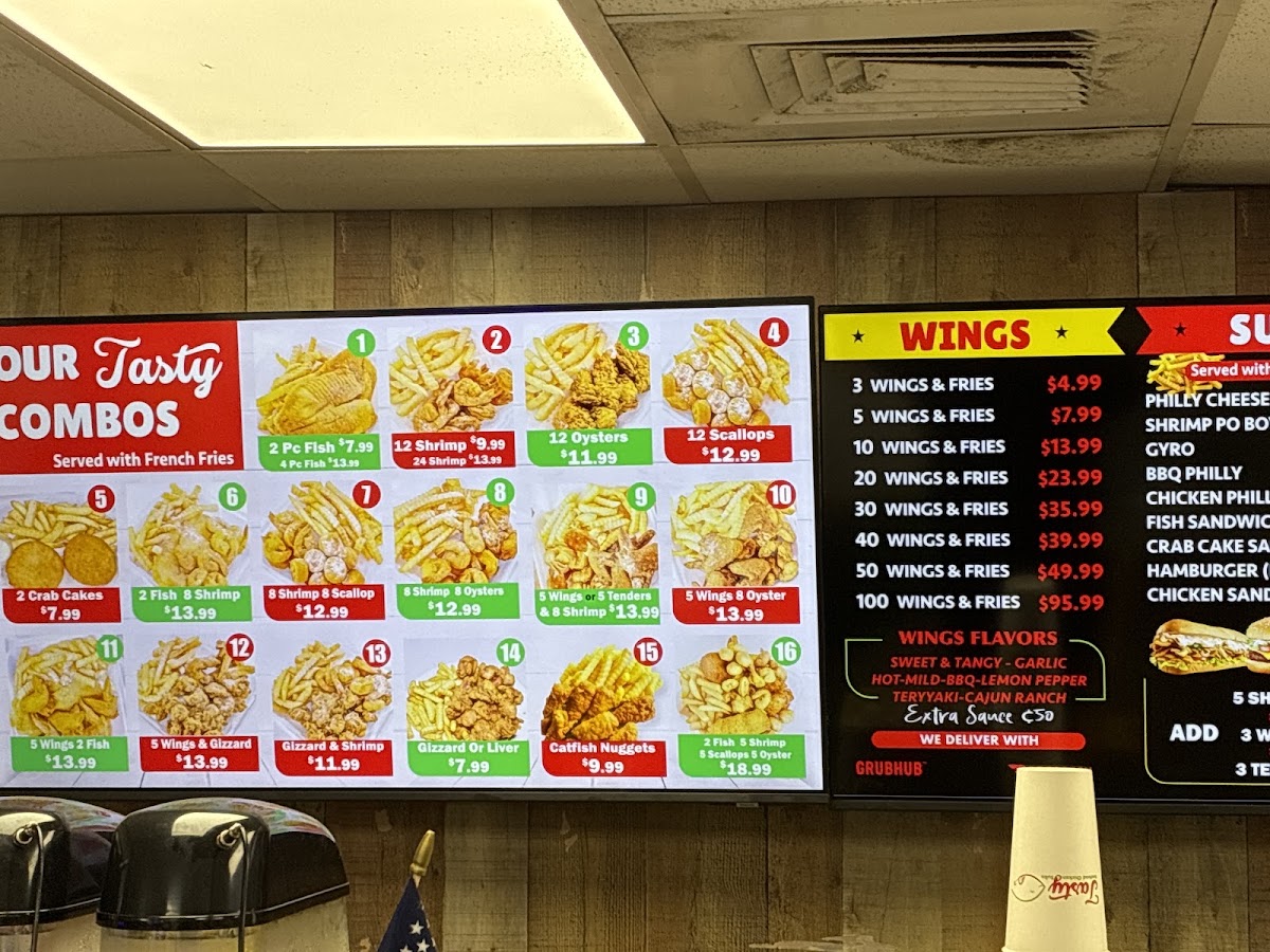 Tasty seafood chicken and subs menu board