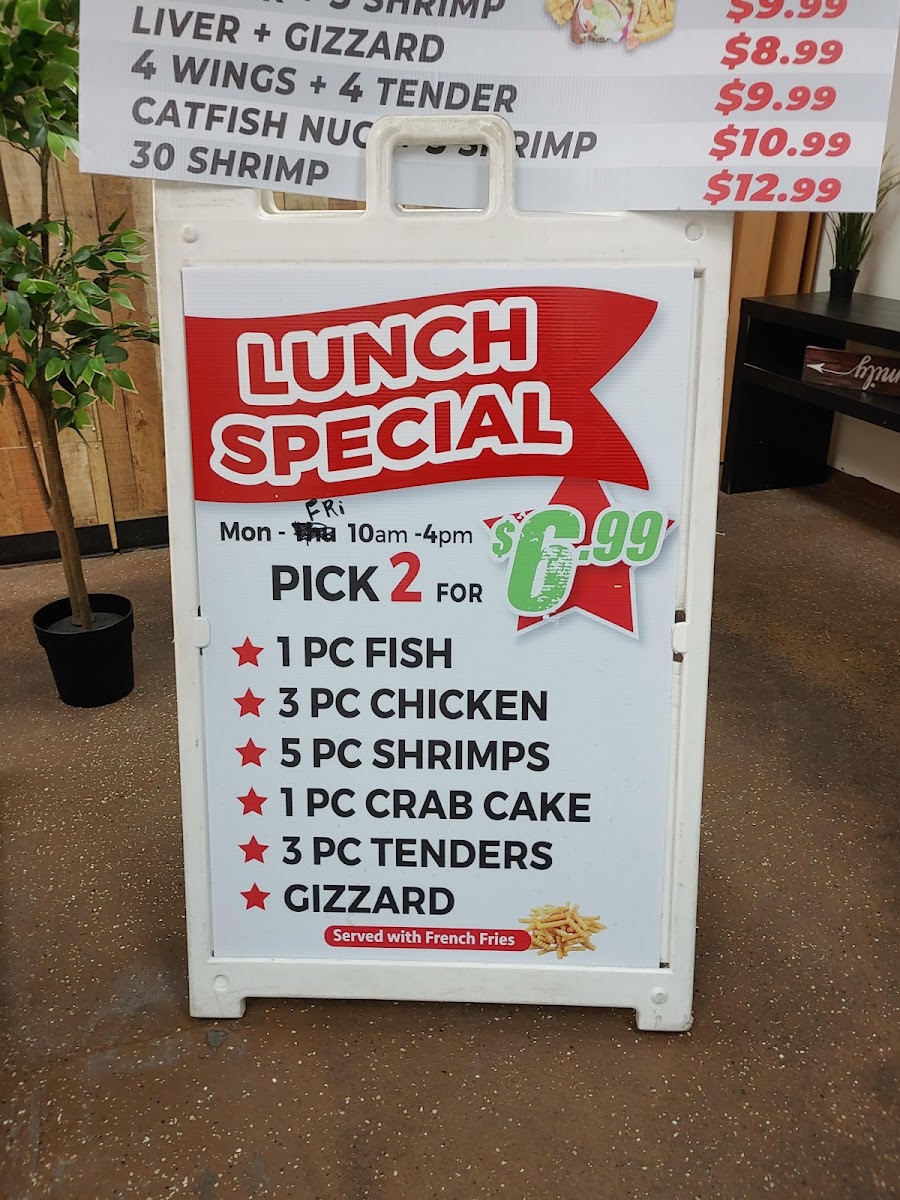 Tasty seafood chicken and subs menu board