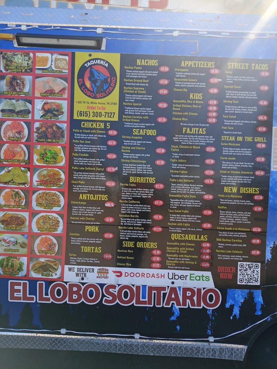 Taqueria el lobo solitario menu board