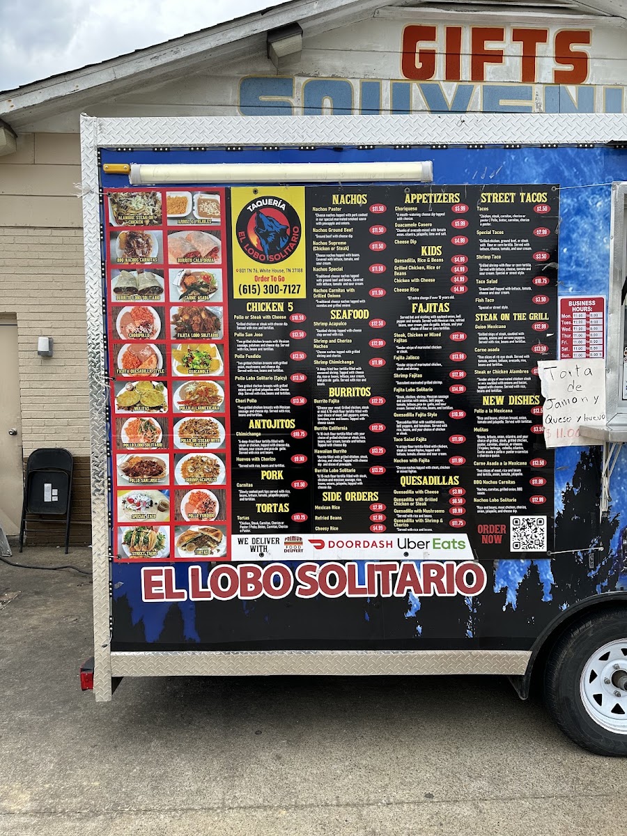 Taqueria el lobo solitario menu board
