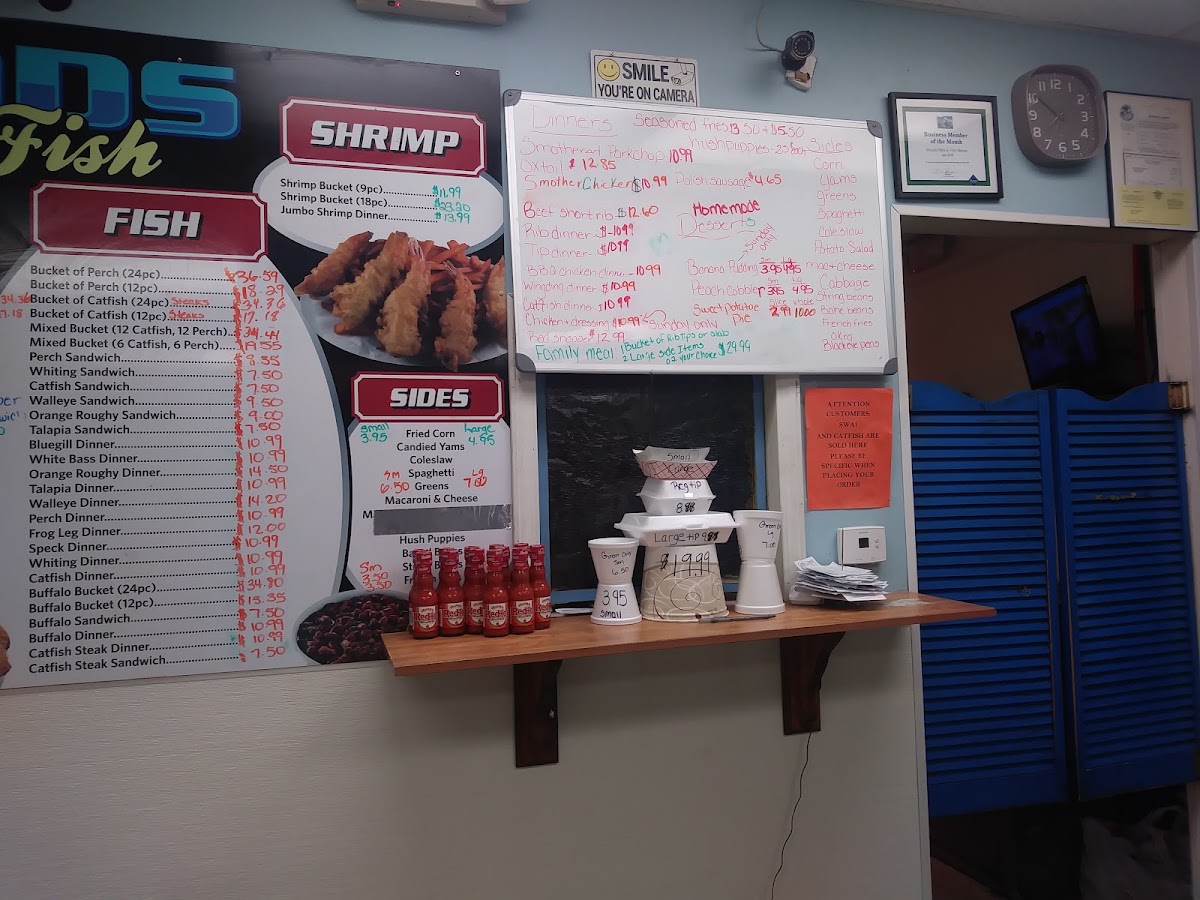 Wood's Ribs & Fish menu board