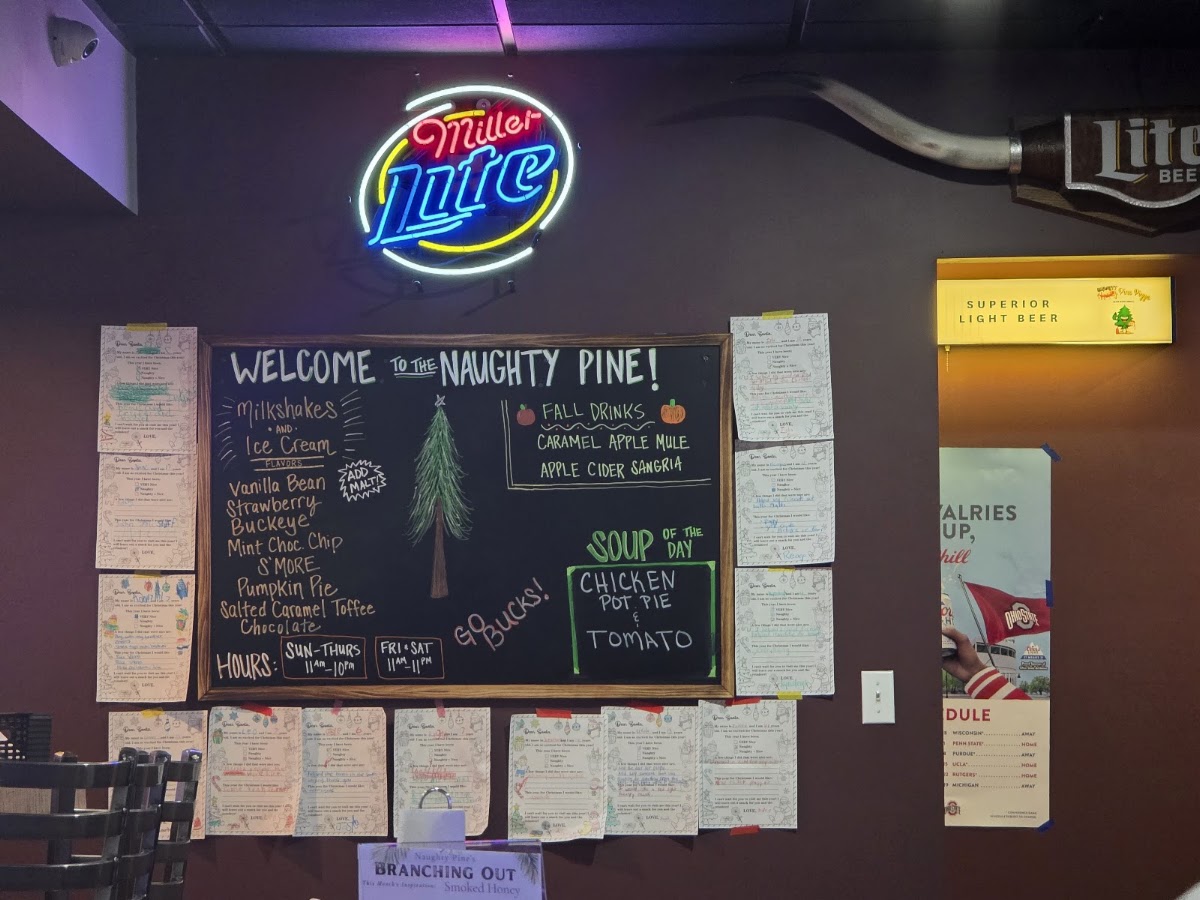 Naughty Pine Pizza Bar & Grill menu board