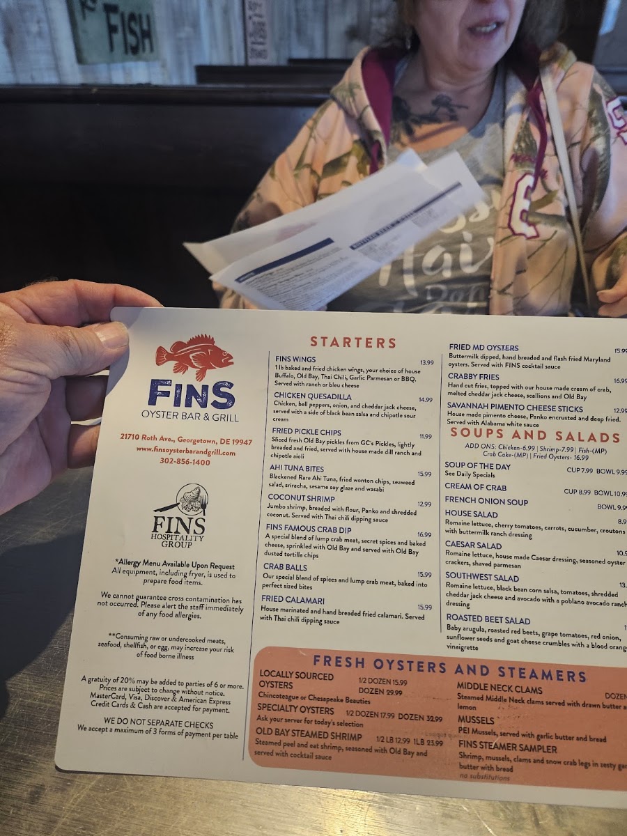 FINS Oyster Bar & Grill menu board