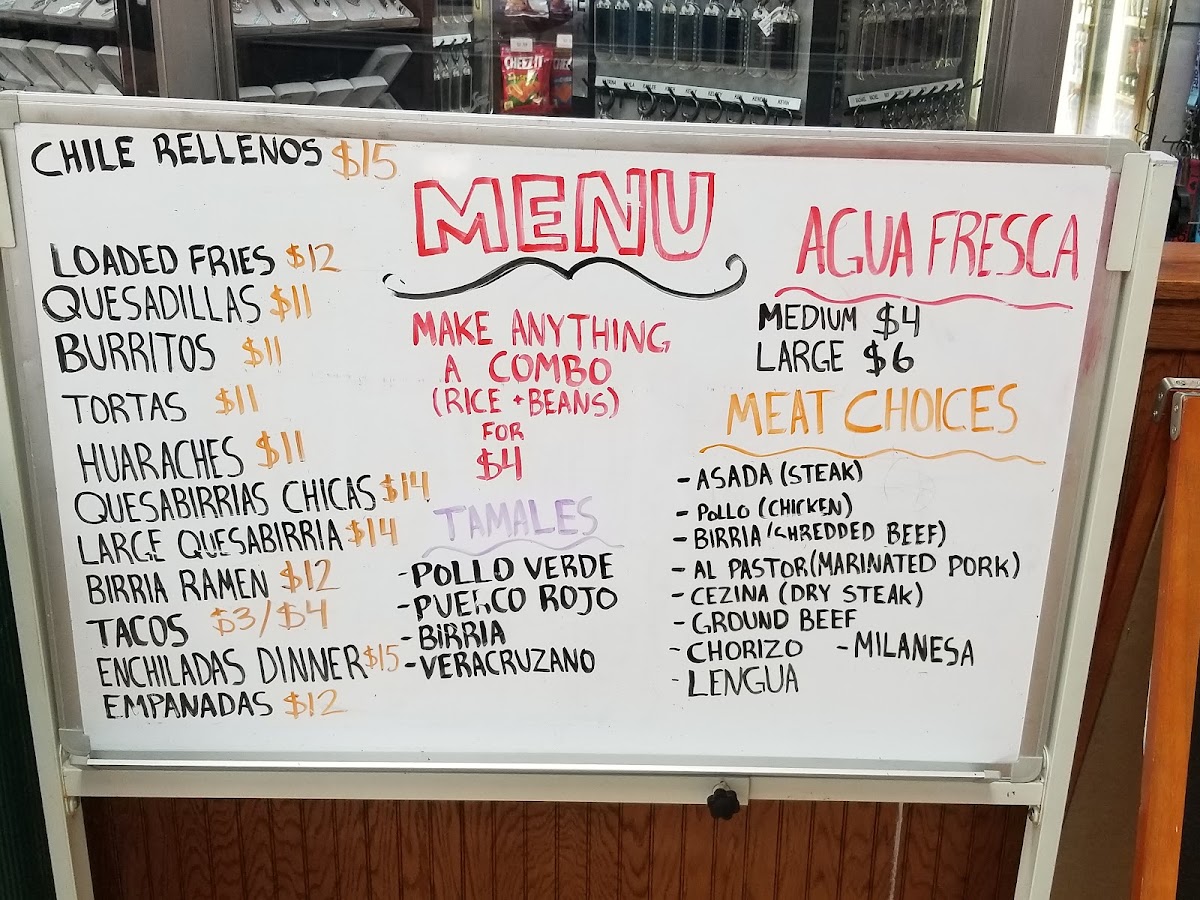 Taqueria Los 3 Molcajetes menu board