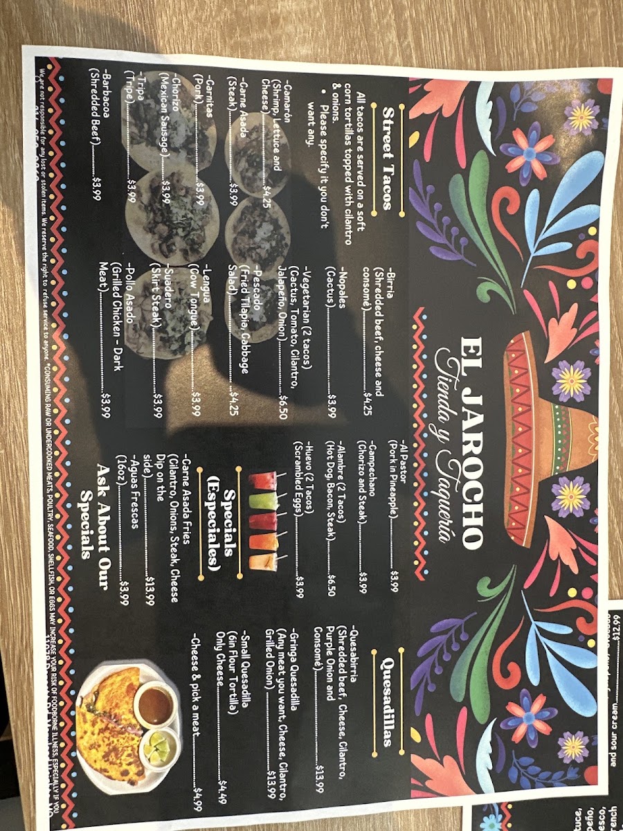 El Jarocho Tienda and Taqueria menu board