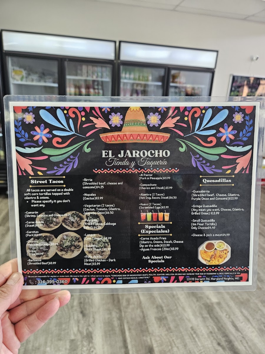 El Jarocho Tienda and Taqueria menu board