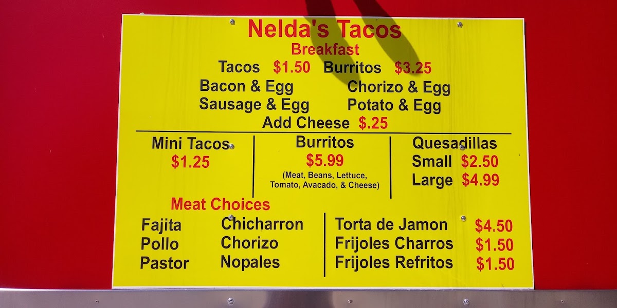 Nelda's Tacos menu board