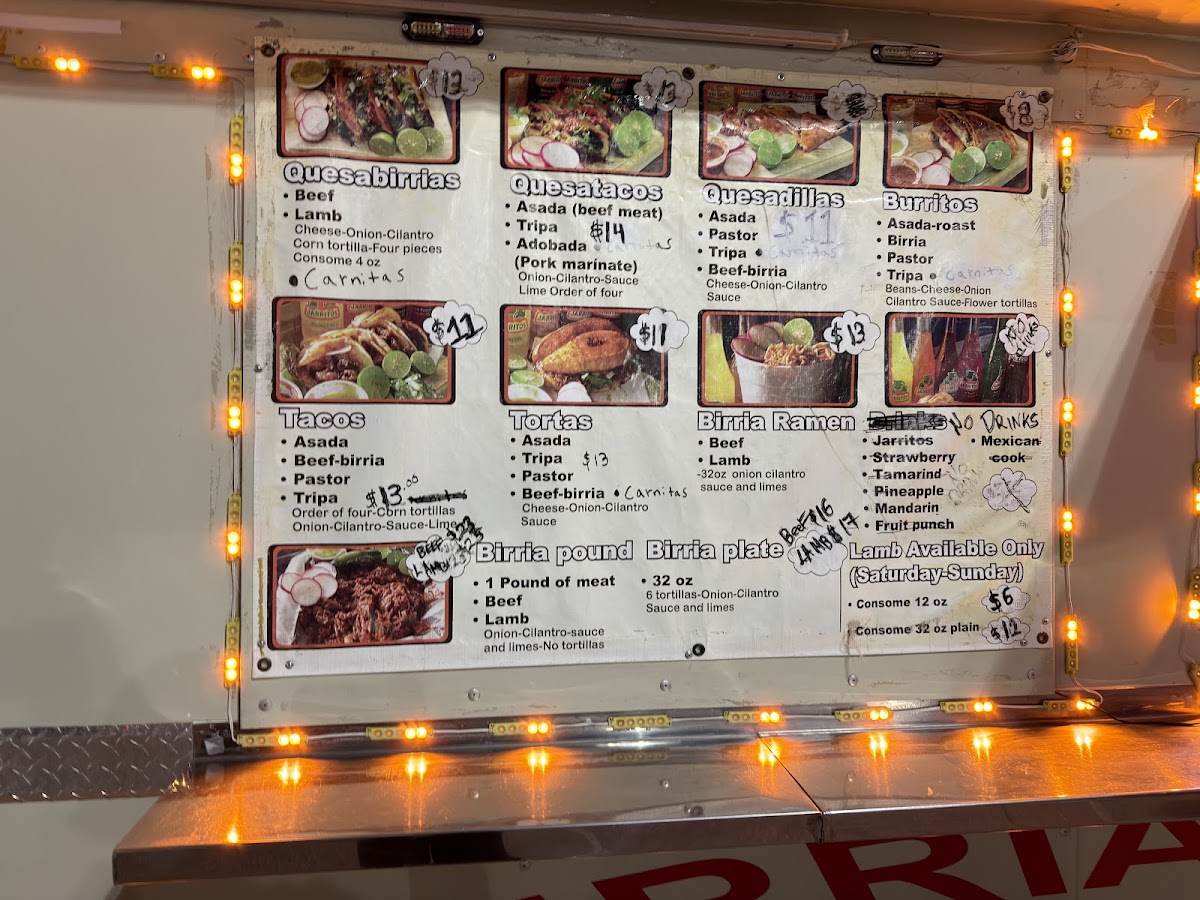 Birria y Tacos El Rey menu board