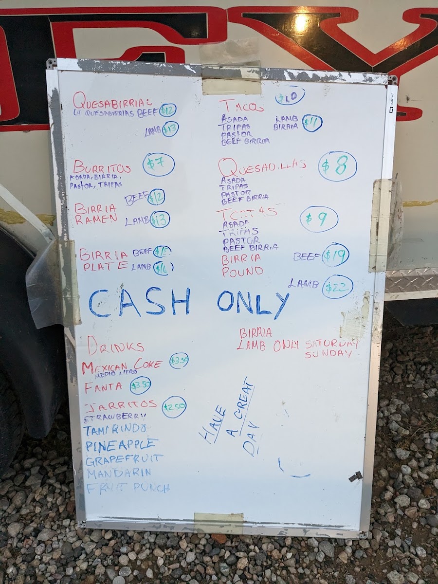 Birria y Tacos El Rey menu board
