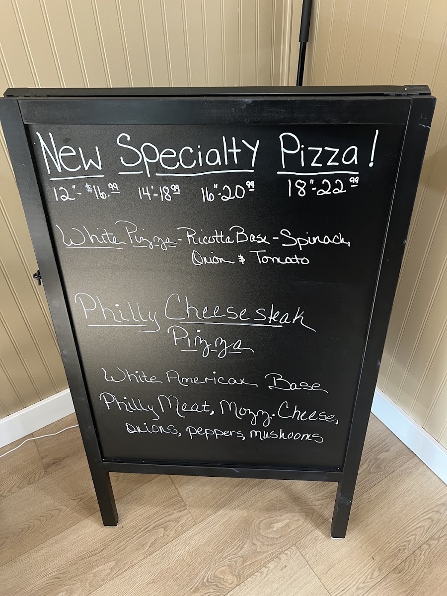 Neighborhood Pizza menu board