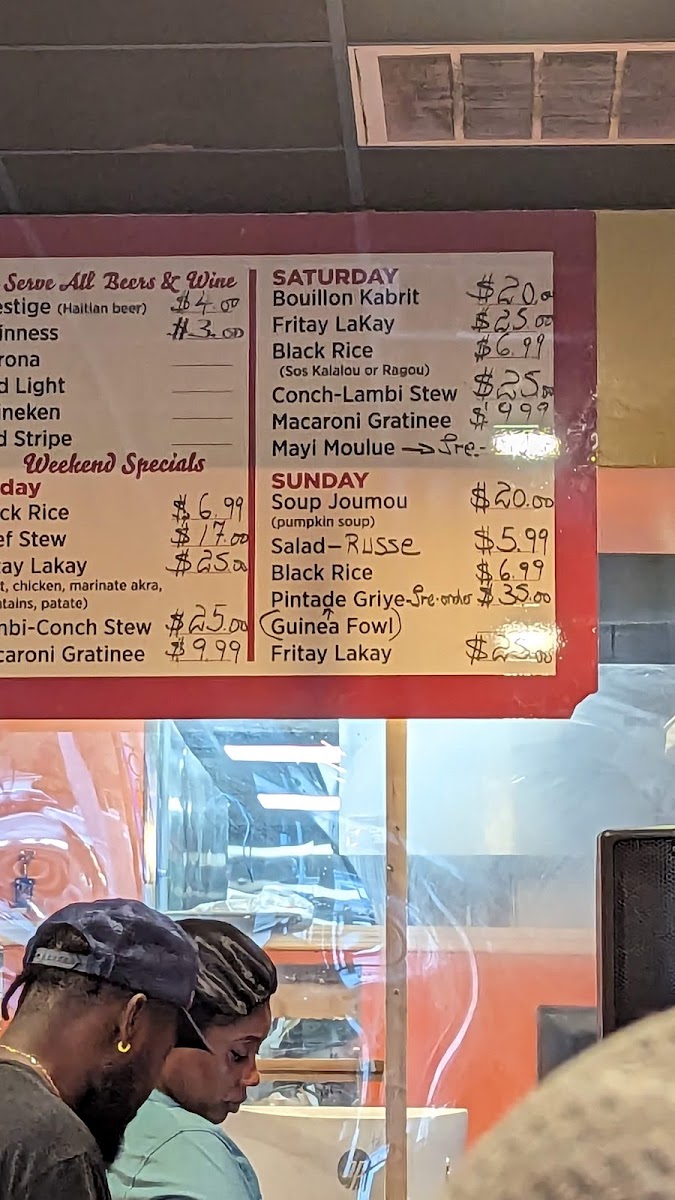 Yummy Yummy Caribbean Food menu board