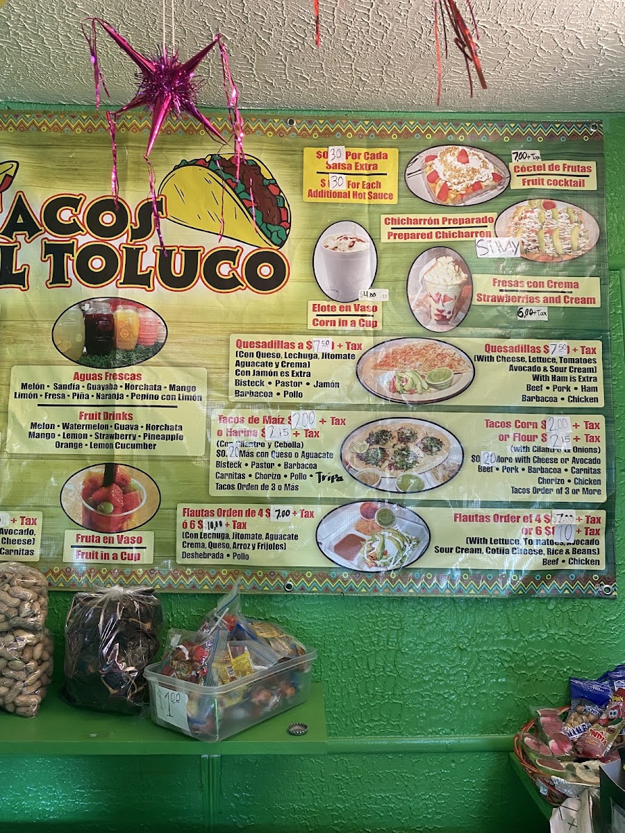 Tacos El Toluco menu board