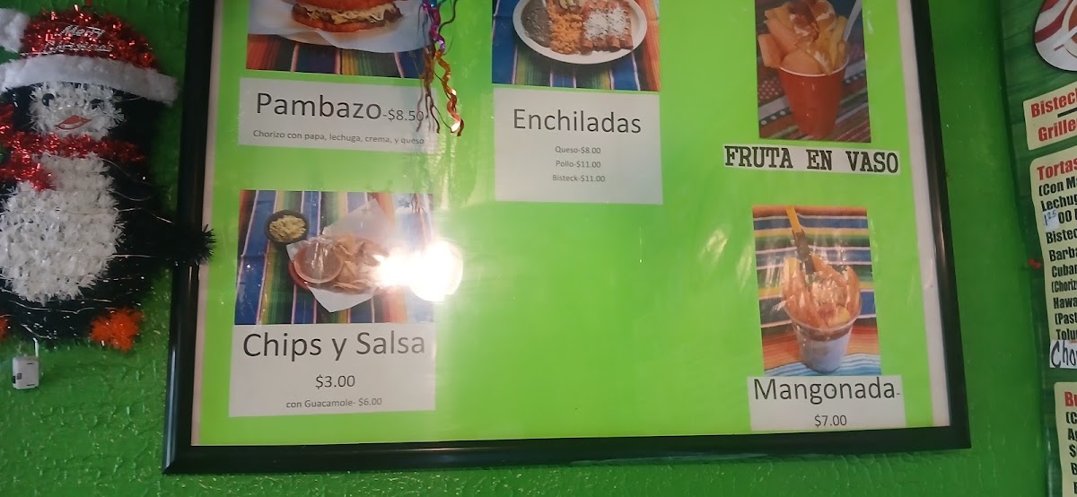 Tacos El Toluco menu board