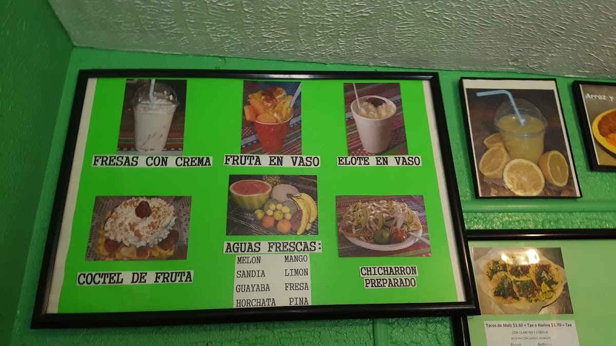 Tacos El Toluco menu board