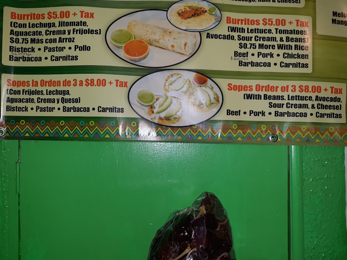 Tacos El Toluco menu board