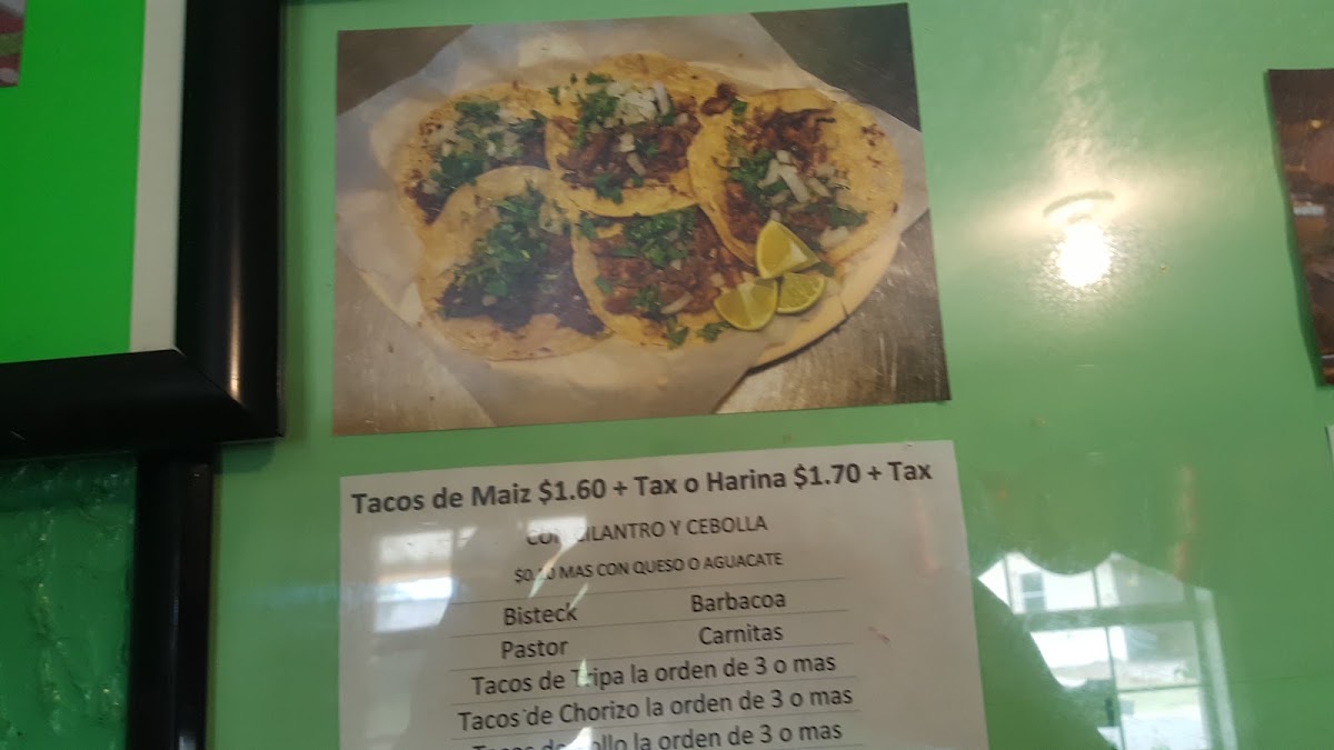 Tacos El Toluco menu board