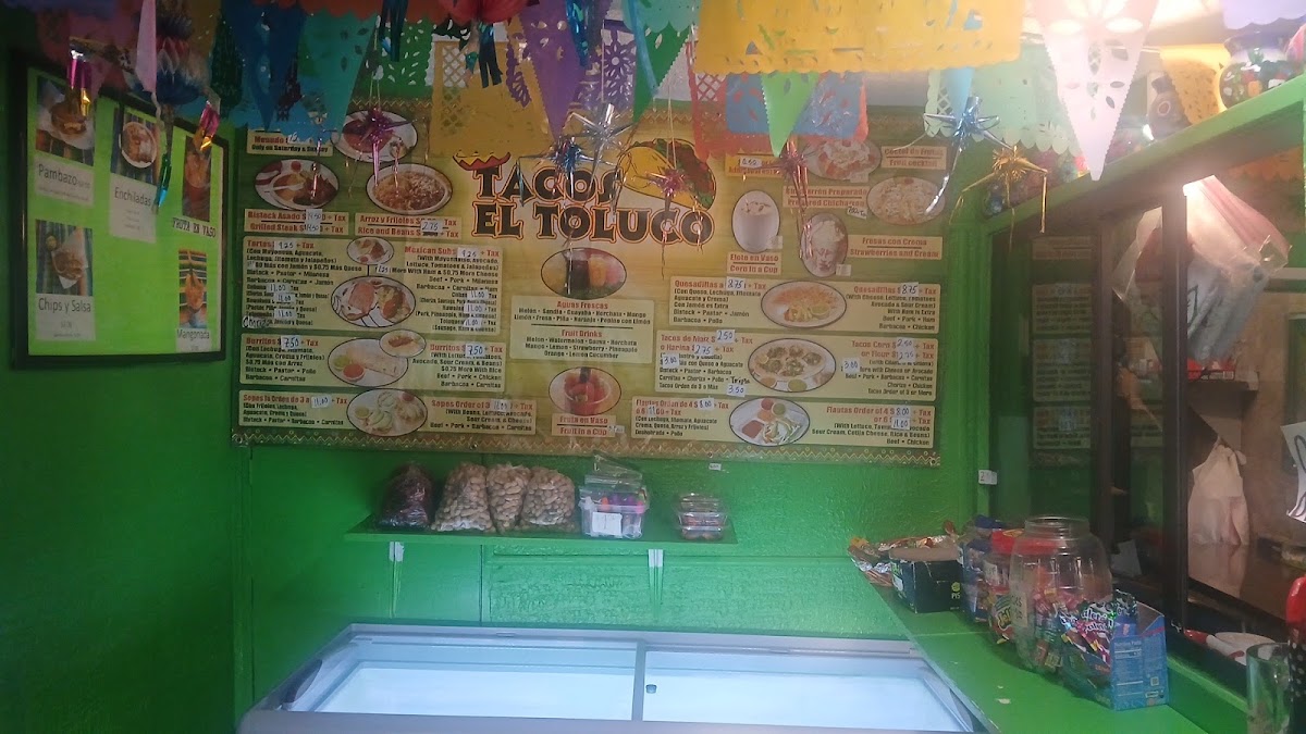 Tacos El Toluco menu board