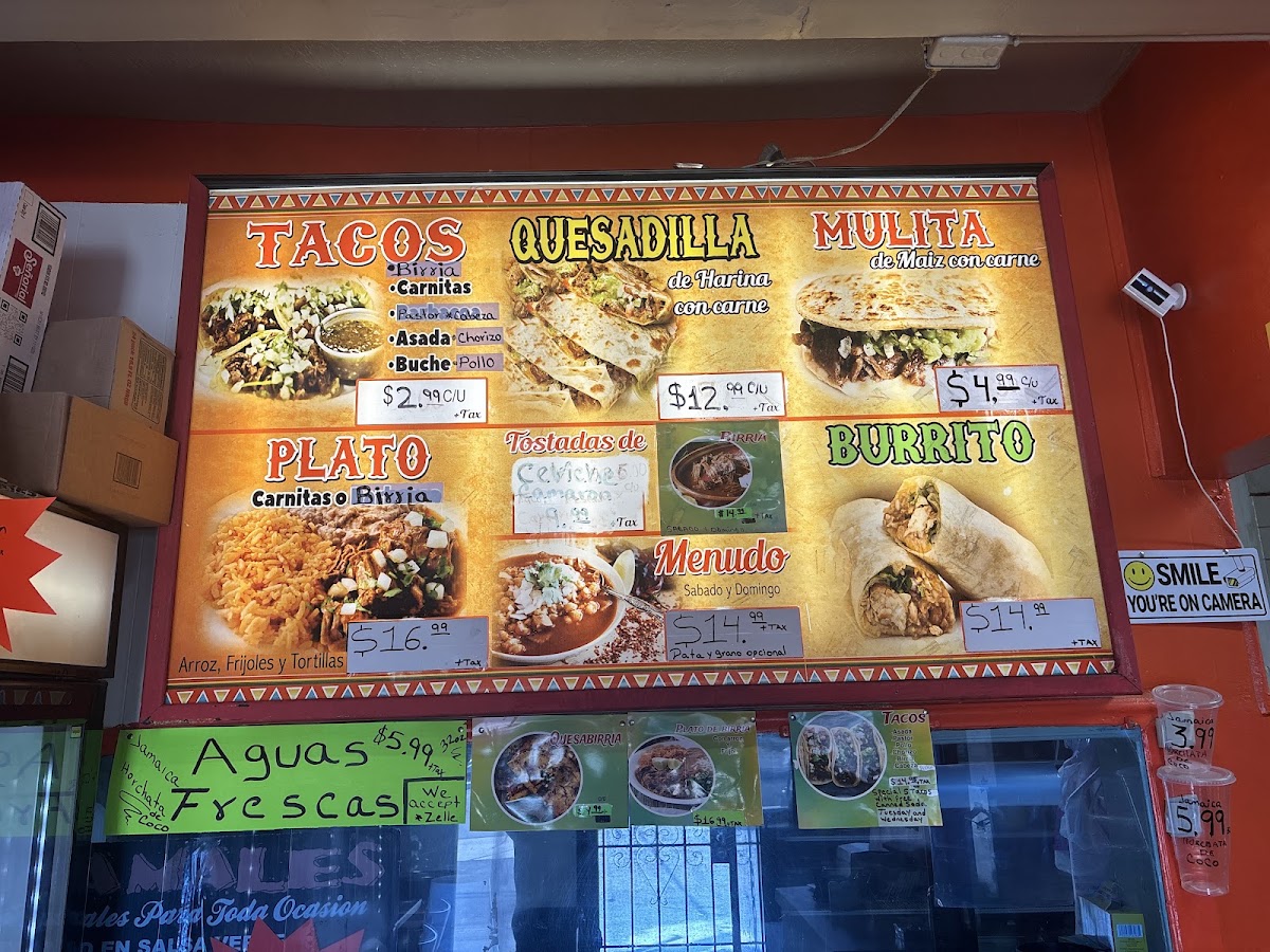Tacos y mariscos Mendoza menu board