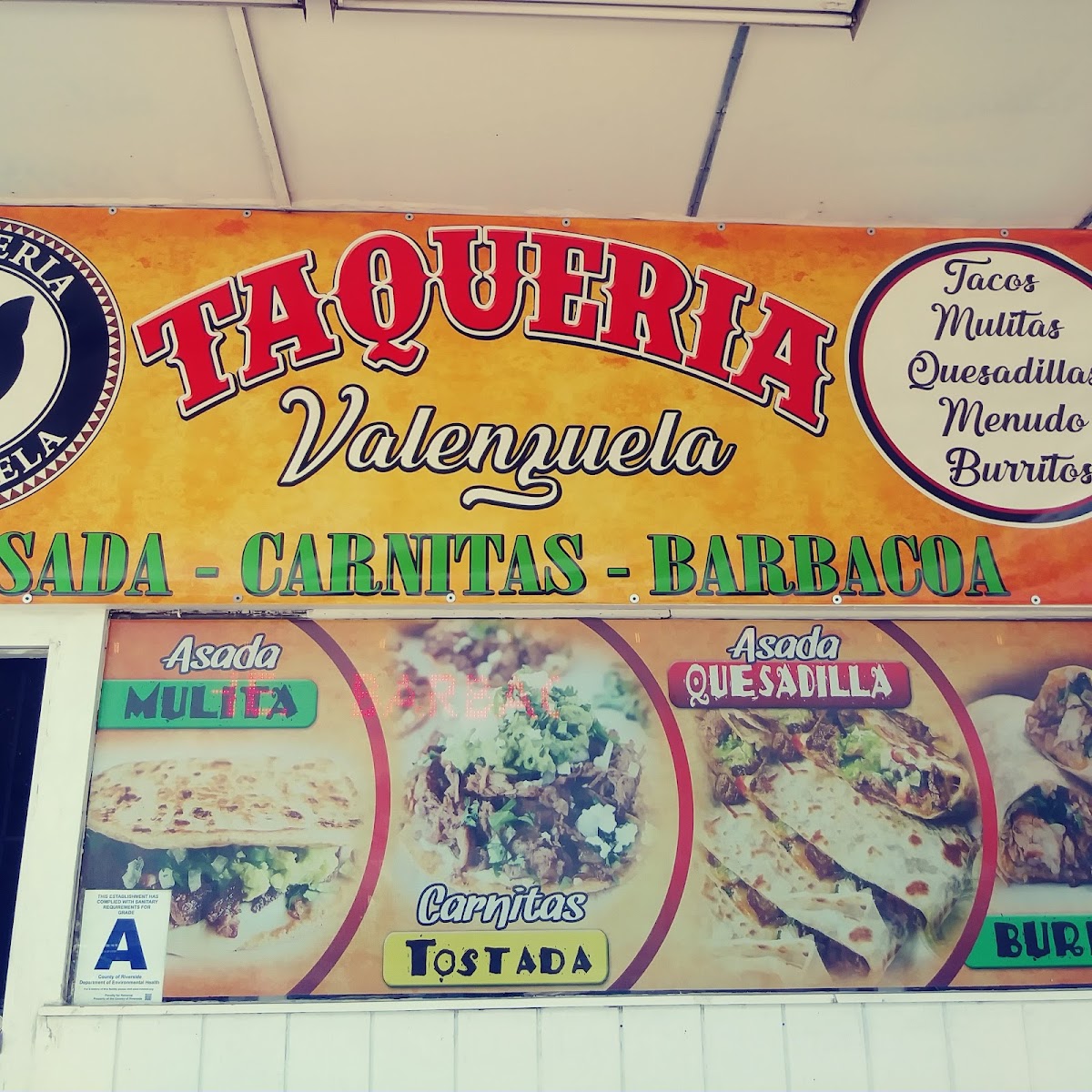 Tacos y mariscos Mendoza menu board