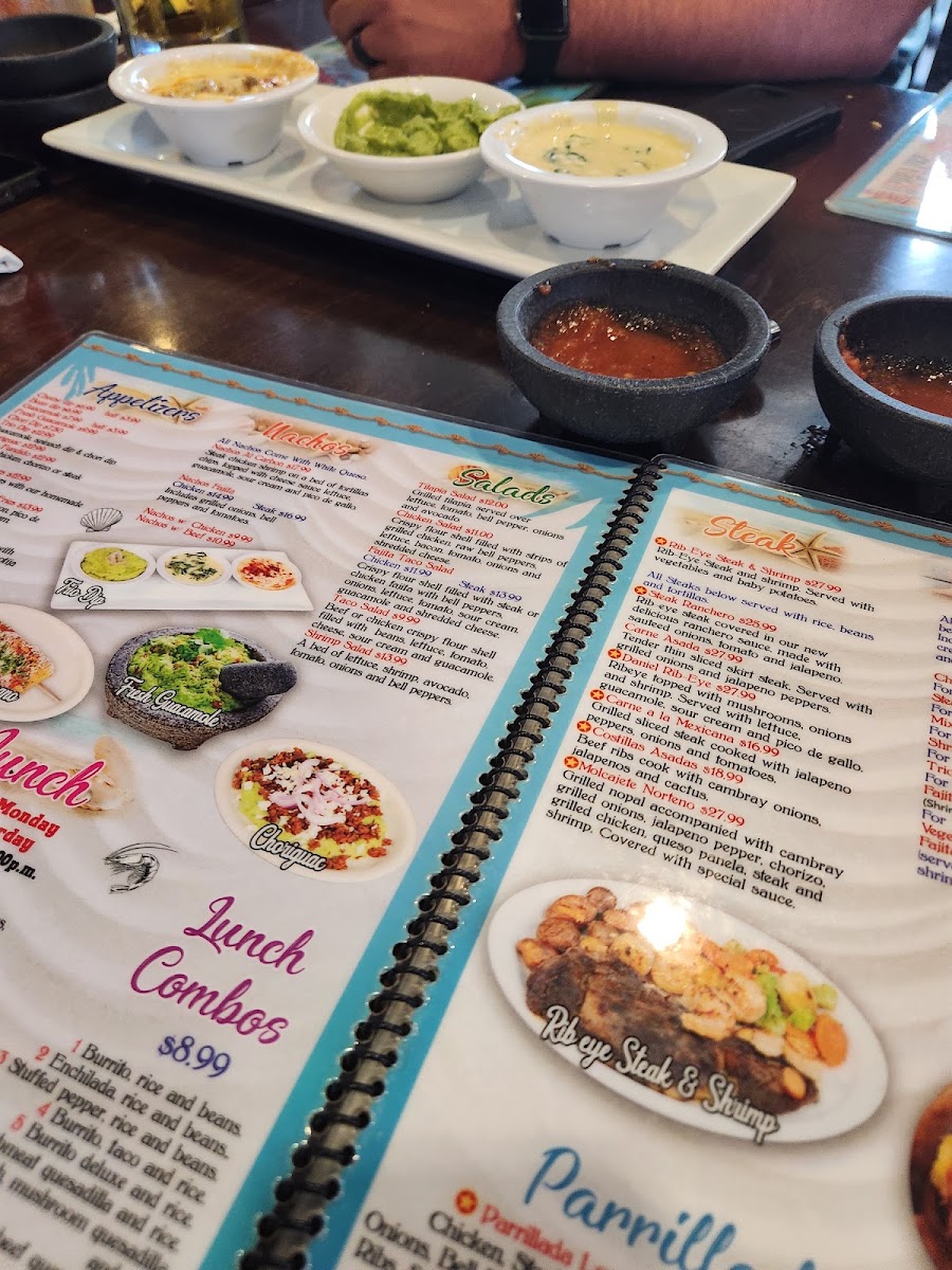 Mariscos Los Plebes menu board