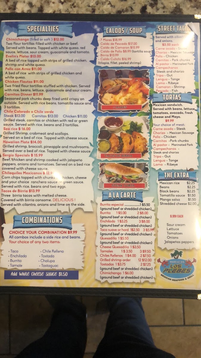 Mariscos Los Plebes menu board