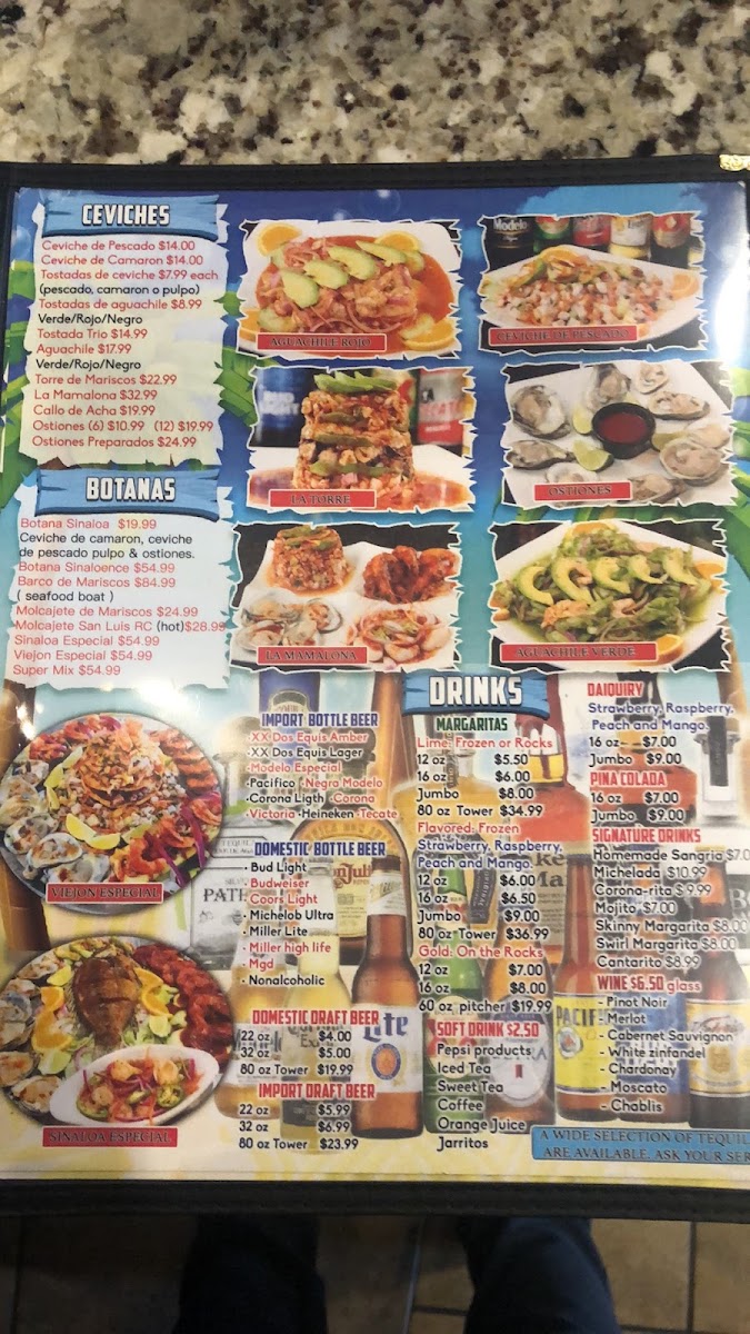 Mariscos Los Plebes menu board
