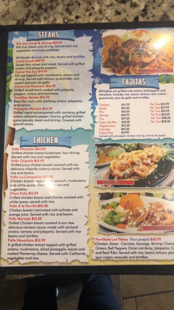 Mariscos Los Plebes menu board