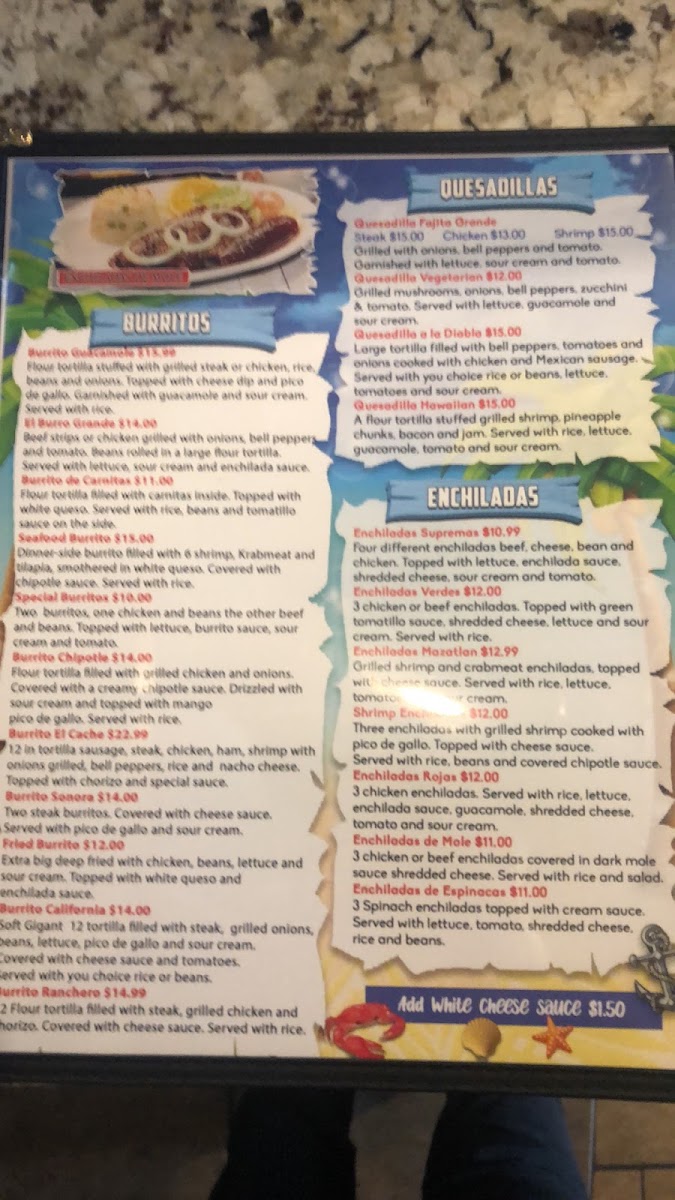 Mariscos Los Plebes menu board