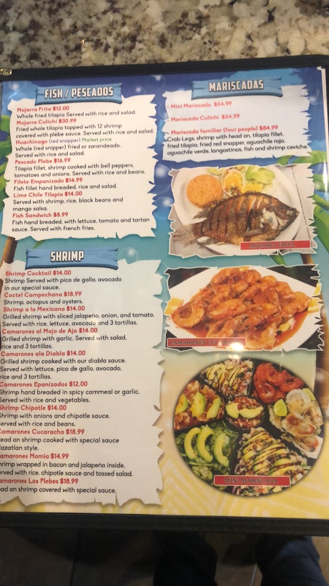 Mariscos Los Plebes menu board